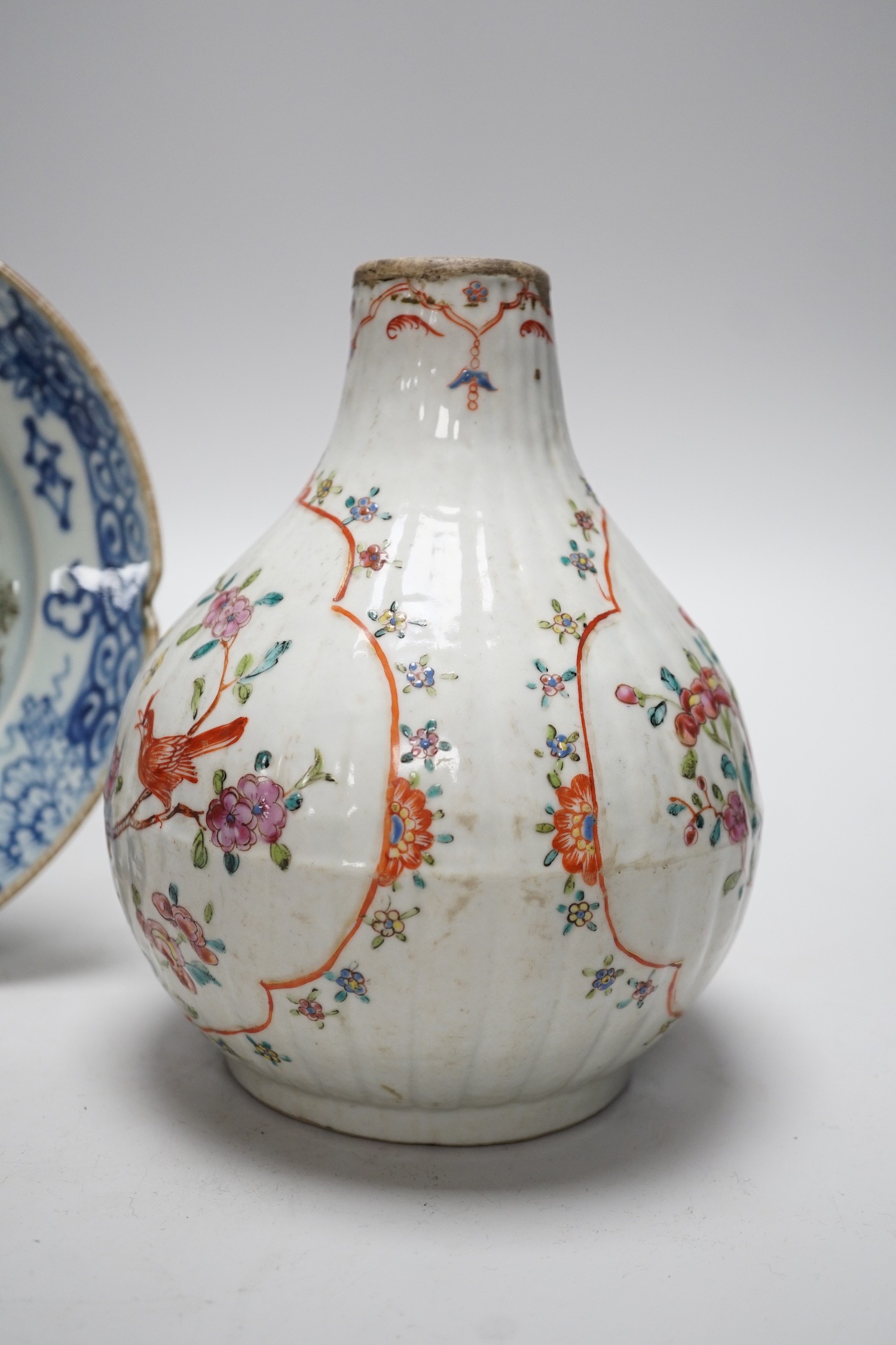 A Chinese Kangxi period clobbered bottle vase, reduced, height 29.5cm, and a Chinese plate, vase 18cms high